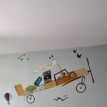 Décoration murale peinte dans une chambre d'enfant réalisée par BMH Rénovation
